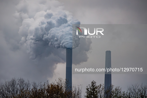 Pollution and steam rise from the stacks of the Miami Fort Power Station, which is situated along the Ohio River near Cincinnati, Ohio, on N... by Jason Whitman/NurPhoto
