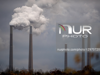 Pollution and steam rise from the stacks of the Miami Fort Power Station, which is situated along the Ohio River near Cincinnati, Ohio, on N... by Jason Whitman/NurPhoto