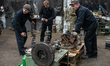 Workers restore damaged military equipment in a repair shop of one of the military logisti...