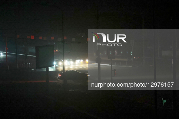 Cars stay at a zebra crossing in complete darkness in Kharkiv, Ukraine, on November 8, 2025. Dozens of streets and neighborhoods are cut off... by Viacheslav Madiievskyi/Ukrinform/NurPhoto
