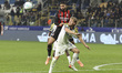 Ruben Loftus-Cheek of AC Milan battles for the ball with Oliver Sorensen of Parma AC durin...