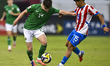 Gavin Mcateer of the Republic of Ireland and Aldo Sanabria of Paraguay are in action durin...