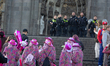 Police are seen as carnival revelers celebrate the opening of Carnival in front of Cologne...
