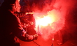 Members of the far-right group Mlodziez Wszechpolska (All-Polish Youth) burn a European Un...