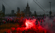 WARSAW, POLAND - NOVEMBER 11, 2025:Crowds march through central Warsaw carrying Polish fl...