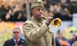 A historical reenactor dressed as a soldier from the First World War plays taps during the...