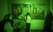 Young Iranian women visit an interactive art show during Tehran Design Week at the Univers...