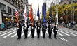 The Port Authority Color Guard pauses as they march up Fifth Avenue during the Veterans Da...