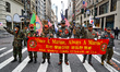 The R.O.K. Marine Corps Veterans of the United States pose for a photo while marching duri...