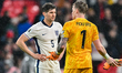 Goalkeeper Jordan Pickford of England talks to John Stones of England after the final whis...
