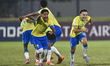 Brazil players celebrate after winning a penalty shootout in their FIFA U-17 World Cup Qat...