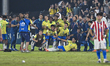 Brazil players and staff celebrate after winning a penalty shootout in their FIFA U-17 Wor...