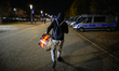 A man with a drum painted in the colors of the local football club is seen in this file ph...
