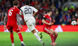 Bojan Miovski of North Macedonia plays the ball past Josh Sheehan of Wales during the FIFA...