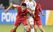 Taiga Seguchi of Japan and Chung Hyok Choe of Korea DPR are in action during the FIFA U-17...