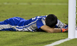 Goalkeeper of Korea DPR, Jong Hun Kim, looks dejected following defeat in the penalty shoo...