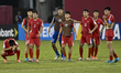 The players of Korea DPR look dejected following their defeat in the penalty shoot-out in...