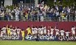 The players of Japan celebrate their victory with the fans after the penalty shootout at t...