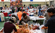Pre-registered participants make kimchi using salted cabbage and seasoning at the 2025 Pye...