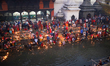 Nepali Hindu devotees float live oil-fed lamps in the sacred Bagmati River in Kathmandu, N...