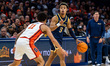 Kevon Vanderhorst dribbles the ball for the Drexel Dragons during an NCAA basketball game...