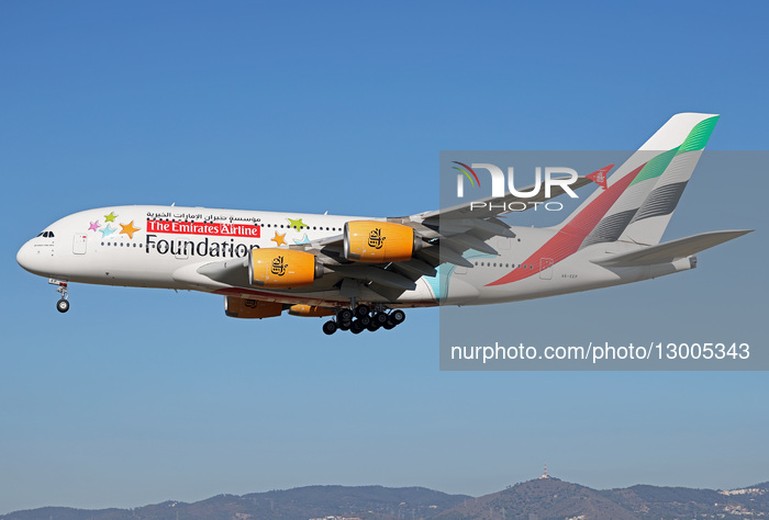 An Emirates Airbus A380 with a special Emirates Airline Foundation livery lands in Barcelona