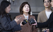 Na Kyung-won, a lawmaker from the People Power Party, speaks to reporters after leaving th...