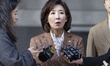 Na Kyung-won, a lawmaker from the People Power Party, speaks to reporters after leaving th...