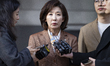 Na Kyung-won, a lawmaker from the People Power Party, speaks to reporters after leaving th...