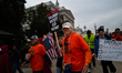Demonstrators march to the U.S. Capitol building in Washington, D.C. on November 20, 2025...