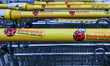RZESZOW, POLAND – NOVEMBER 20:Biedronka shopping trolleys are neatly arranged outside a s...