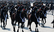 Members of the Mexican armed forces, mounted on horseback, participate in the Civic Milita...