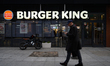 A man walks past a Burger King restaurant in the city center in Warsaw, Poland, on Novembe...