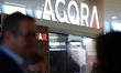 The Agora logo is seen at the 10th Open Eyes Economy Summit at the ICE Krakow Congress Cen...