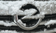 KRAKOW, POLAND - NOVEMBER 21:The OPEL logo is displayed on a rain and snow-covered vehicl...