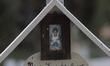 A photograph shows a woman on a cross inside the Dolores Cemetery in Mexico City, Mexico,...