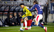 NAC Breda forward Charles Brym and PSV Eindhoven defender Yarek Gasiorowski play during th...
