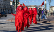 The Red Rebel Brigade performs on a small island formed by the unusually low flow of the r...