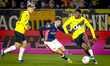 PSV Eindhoven midfielder Guus Til and NAC Breda defender Cherrion Valerius play during the...