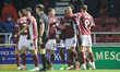 Ethan Wheatley celebrates with teammates after scoring for Northampton Town and equalizes...