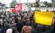 Protesters gather in front of the municipal swimming pool, restored by order of the Tunisi...