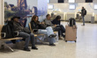 Passengers with their flight cancelled waiting in the airport terminal. Eindhoven Airport...