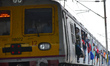 Commuters travel on a suburban train during a smoggy day in Kolkata, India, on November 23...