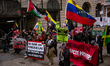 In response to the Trump administration's escalation with Venezuela, protesters gather in...