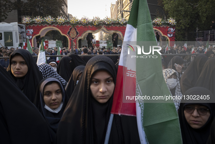 Veiled Iranian Women Participate In A Funeral For Unknown Martyrs