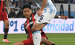 Enzo Perez of River Plate competes for the ball with Juan Ignacio Nardoni of Racing during...