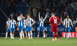Players of RCD Espanyol celebrate a goal by Roberto Fernandez Jaen in front of Alexis Sanc...