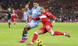 Samuel Silvera of Middlesbrough looks to cross the ball while being challenged by Kaine Ke...