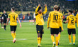Karim Adeyemi of Borussia Dortmund celebrates his team's third goal with teammates during...