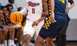 FLASH BURTON (11) possesses the ball for the Rider Broncs during an NCAA men's basketball...